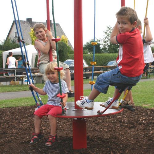 Children play on the acrobatics turntable