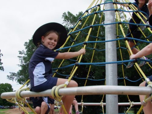Child playing on climbing whirl
