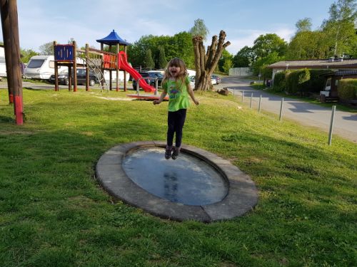 Girl jumps on trampoline Saturnus