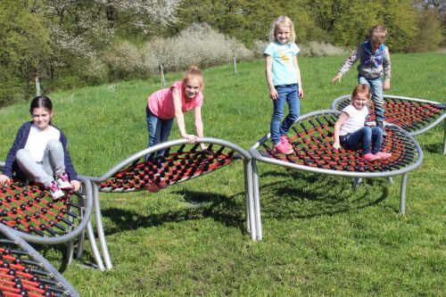 Children on a roller coaster made of net